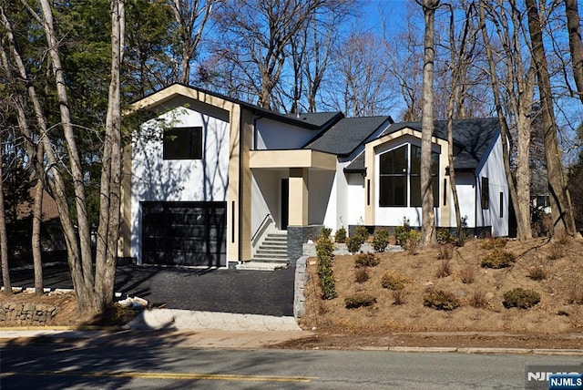 view of front of property with a garage and driveway