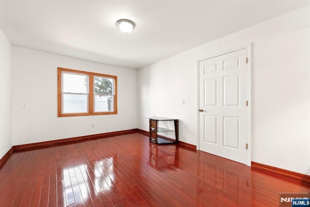 spare room with hardwood / wood-style floors