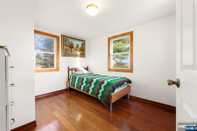 bedroom with hardwood / wood-style floors