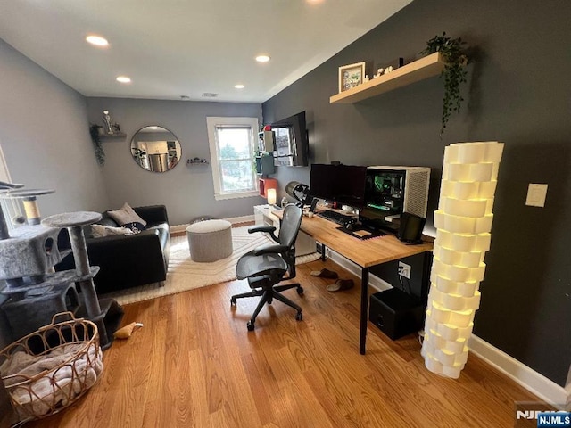 office with light hardwood / wood-style floors