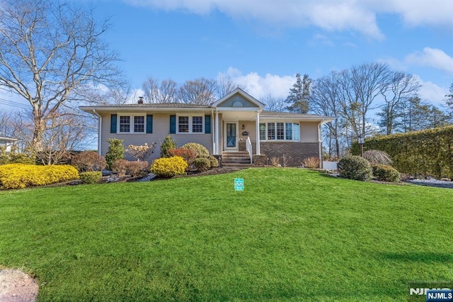 ranch-style house with a front lawn