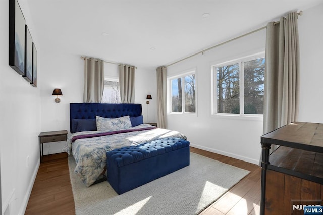 bedroom with wood-type flooring