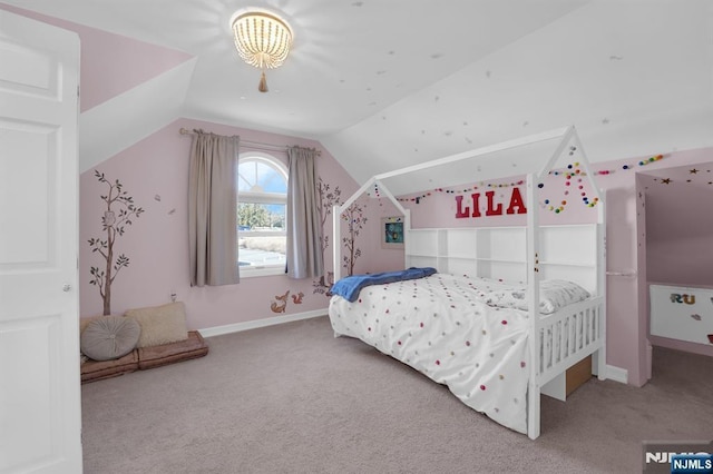 bedroom with carpet flooring and vaulted ceiling