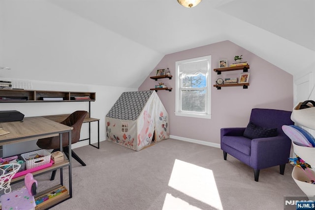 game room with vaulted ceiling and light colored carpet