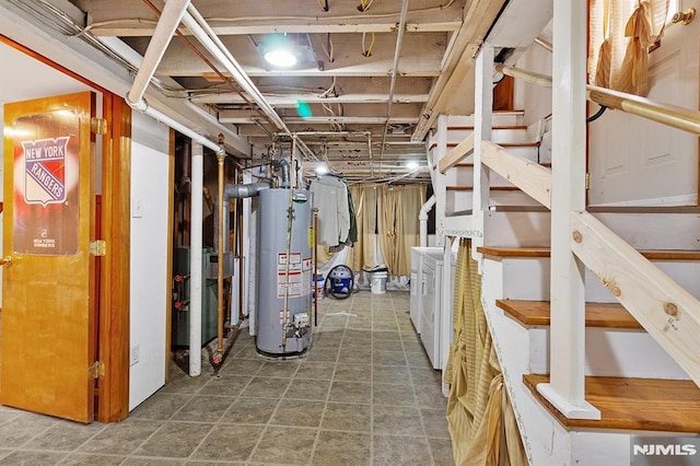 basement featuring gas water heater and independent washer and dryer