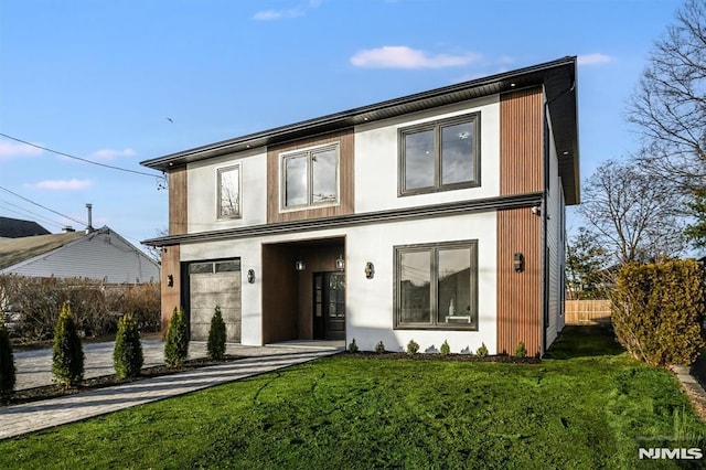 contemporary house featuring a front yard