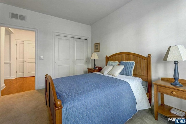 carpeted bedroom with a closet