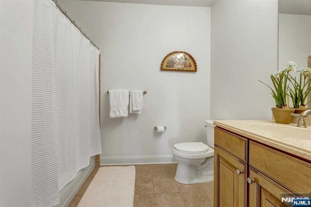 full bathroom with tile patterned floors, vanity, toilet, and shower / bath combo