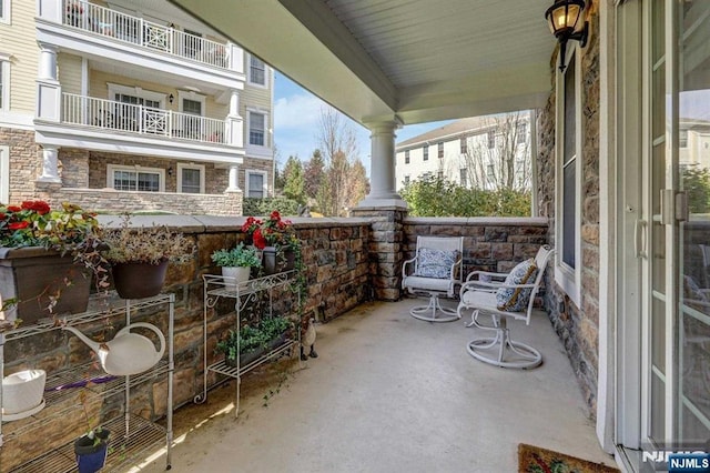 balcony featuring covered porch