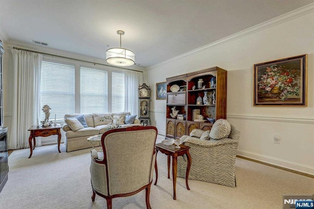 living room with crown molding and light carpet