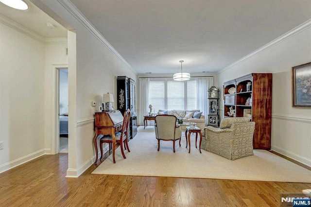 living room featuring ornamental molding and wood-type flooring