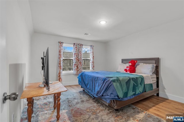 bedroom featuring hardwood / wood-style flooring