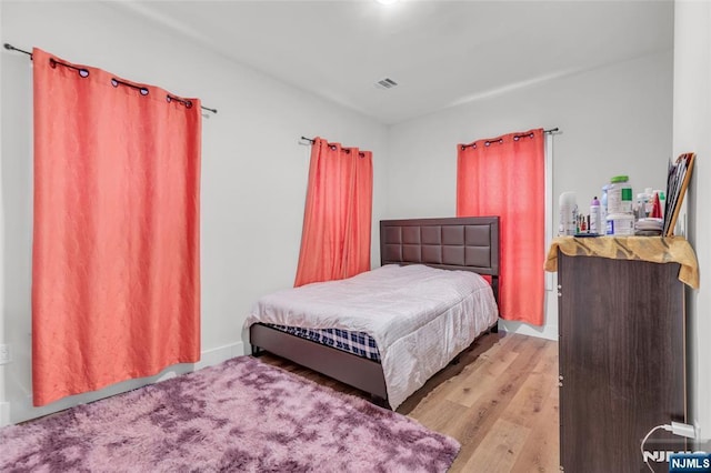 bedroom with light hardwood / wood-style floors