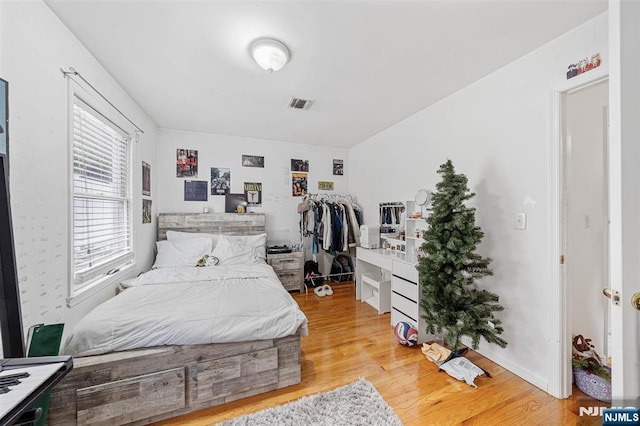 bedroom with light hardwood / wood-style floors