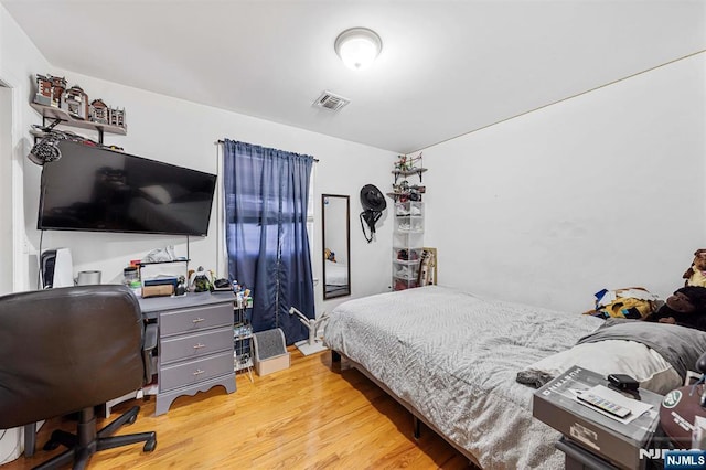 bedroom with light hardwood / wood-style floors