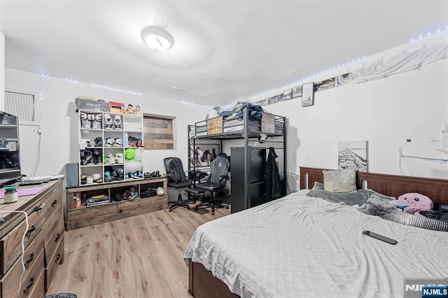 bedroom featuring light wood-type flooring