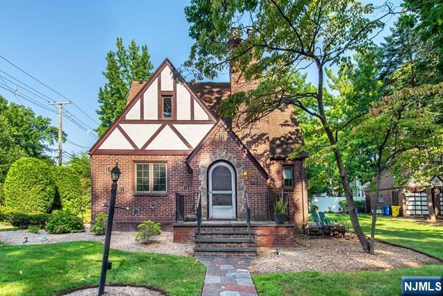 tudor house featuring a front yard