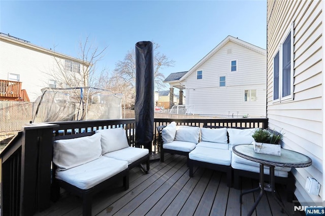 wooden deck featuring an outdoor living space