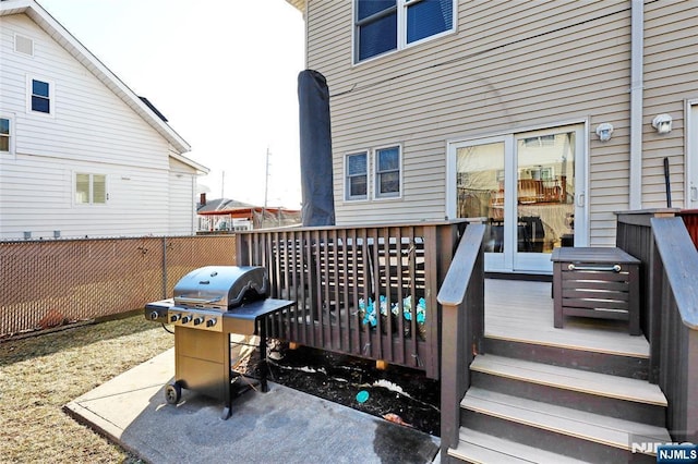 deck featuring a grill