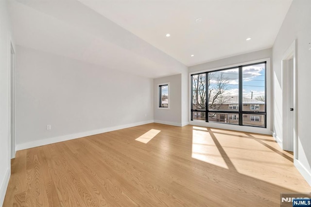 unfurnished living room with plenty of natural light and light wood-type flooring