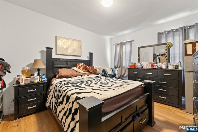 bedroom featuring light hardwood / wood-style floors