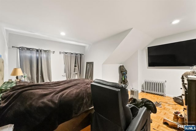 bedroom featuring radiator and parquet floors