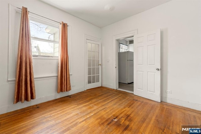 empty room featuring wood-type flooring