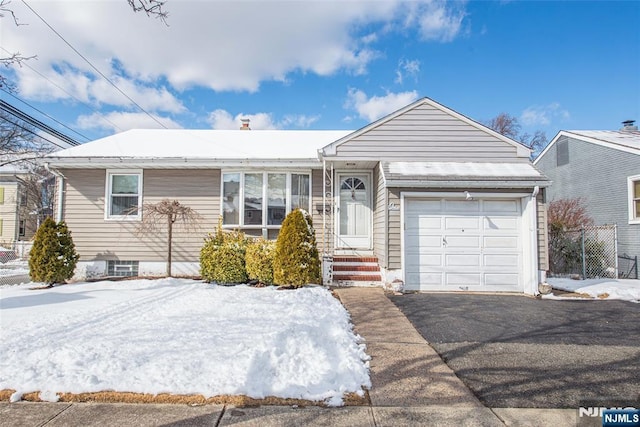 single story home featuring a garage