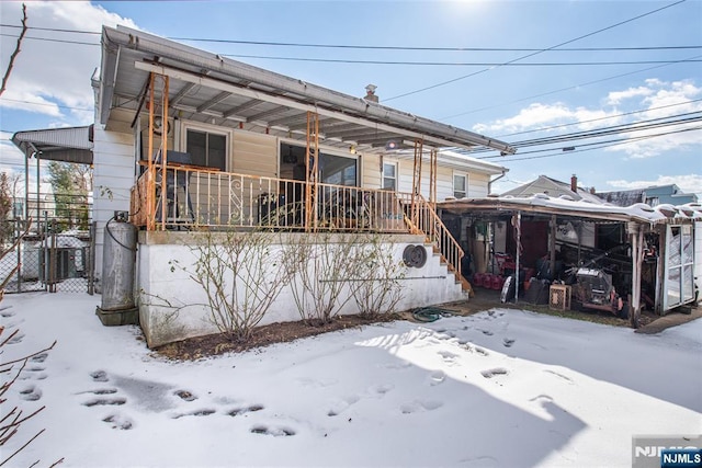 exterior space featuring a porch and central AC