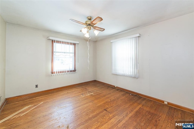 unfurnished room featuring hardwood / wood-style flooring and ceiling fan