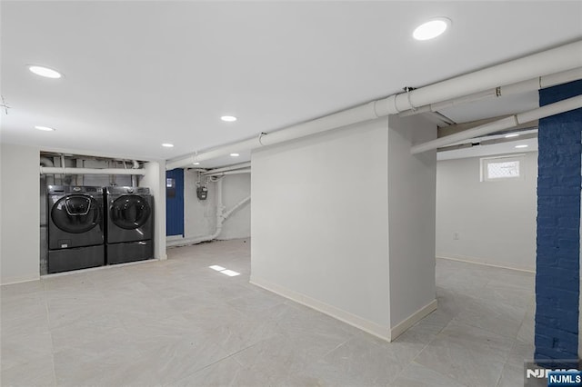 basement featuring washing machine and clothes dryer