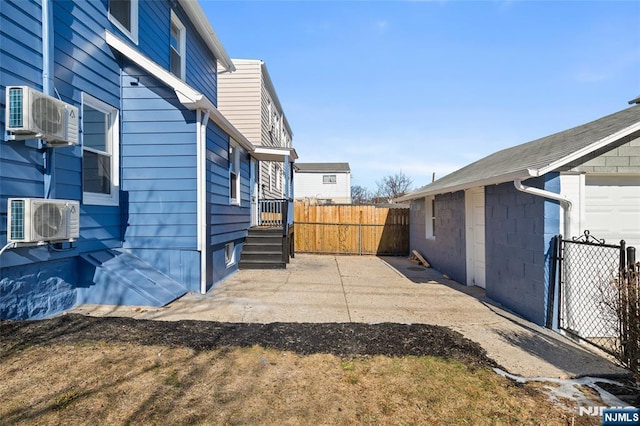 view of yard with a patio and ac unit