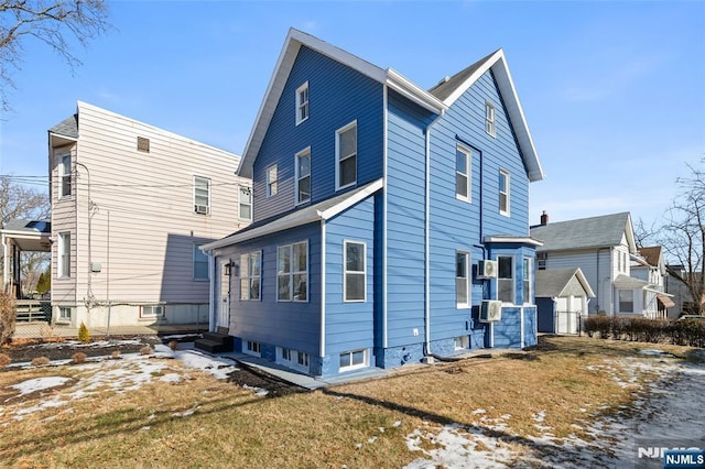 rear view of house with a yard