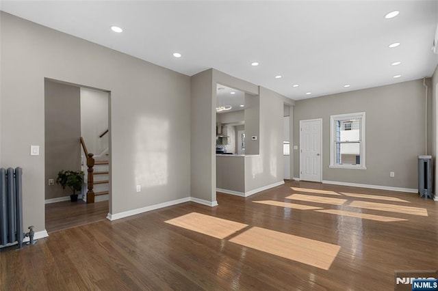 interior space featuring radiator and dark hardwood / wood-style flooring