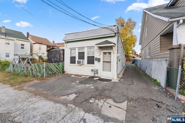 view of front of property featuring cooling unit