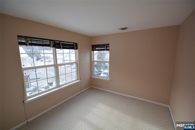 unfurnished room with carpet