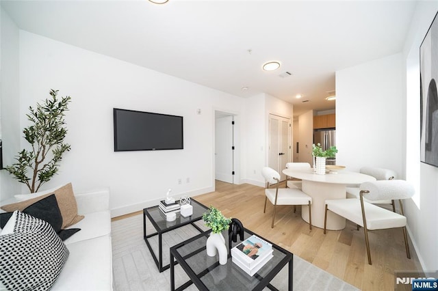 living room with light hardwood / wood-style floors