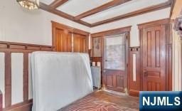 interior space with beamed ceiling and coffered ceiling