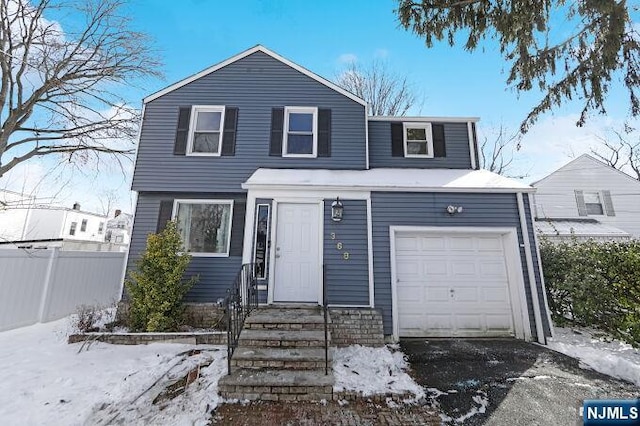 front of property with a garage