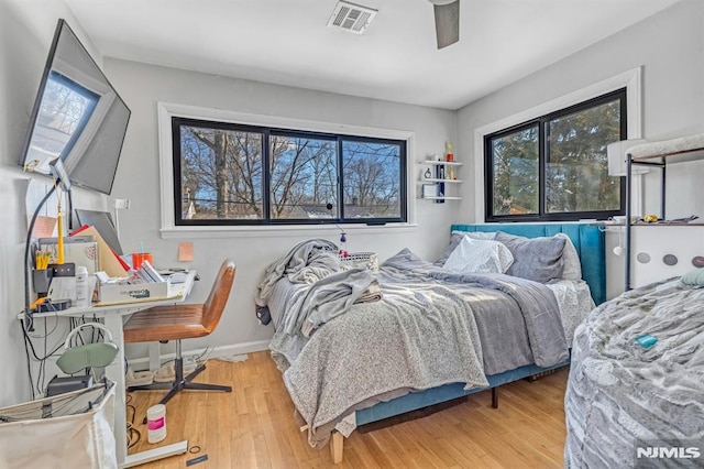 bedroom featuring ceiling fan and light wood-type flooring