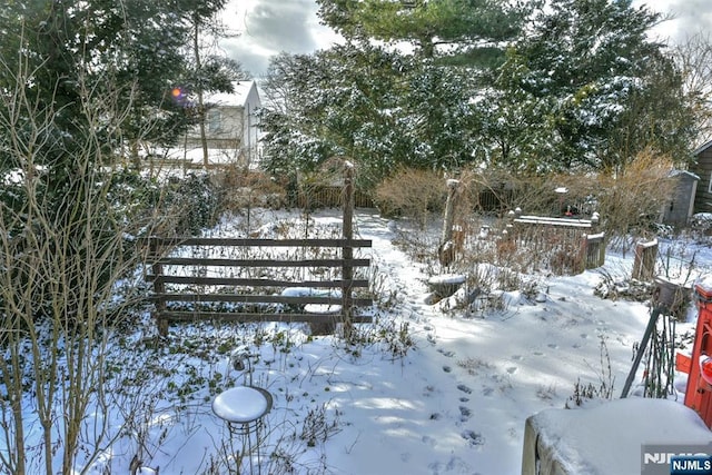 view of yard layered in snow