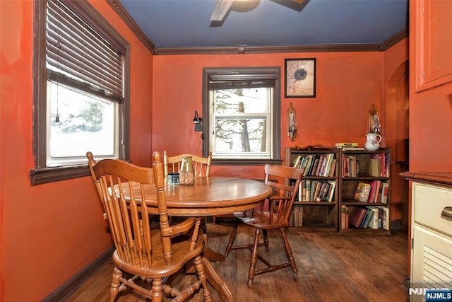 dining area featuring wood-type flooring, a healthy amount of sunlight, and ceiling fan