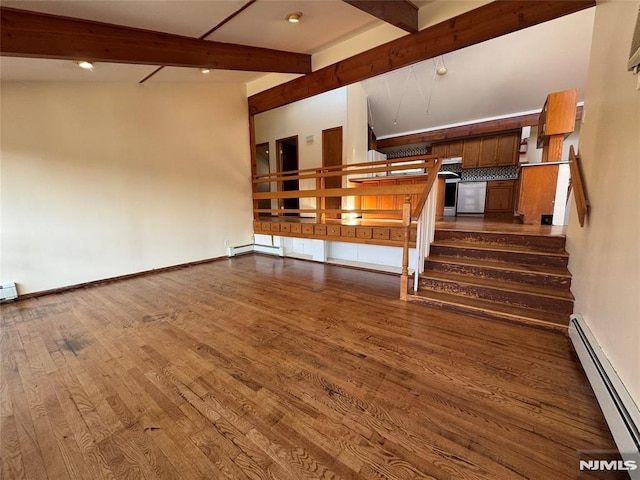 unfurnished living room featuring hardwood / wood-style flooring, a baseboard radiator, and vaulted ceiling with beams