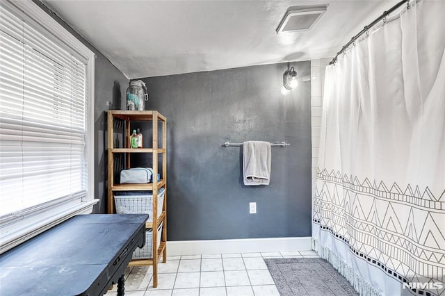 bathroom with tile patterned flooring