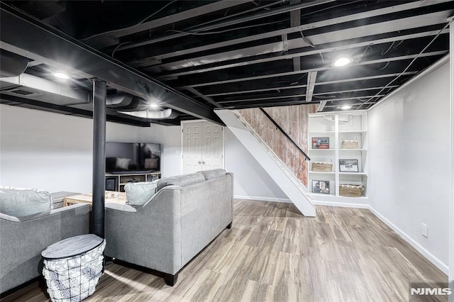 basement featuring wood-type flooring