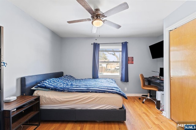 bedroom featuring hardwood / wood-style floors and ceiling fan