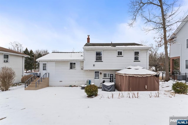 view of snow covered house