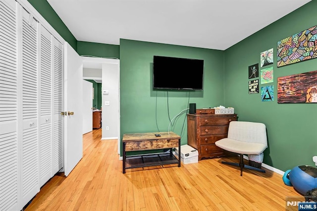 sitting room featuring light hardwood / wood-style floors