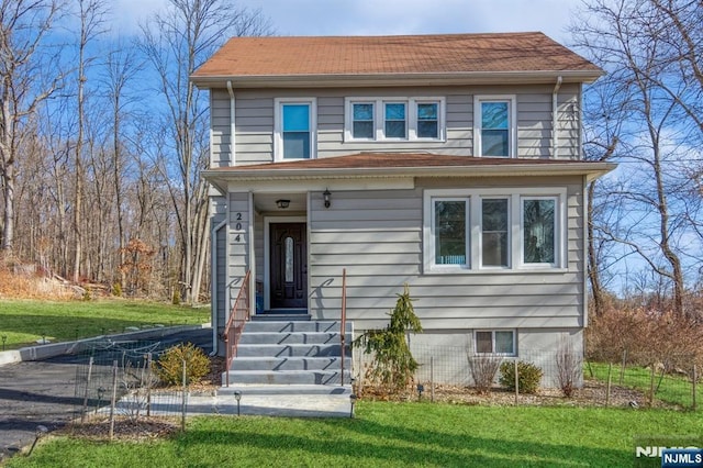 view of front of home with a front lawn