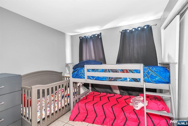 bedroom with light tile patterned floors